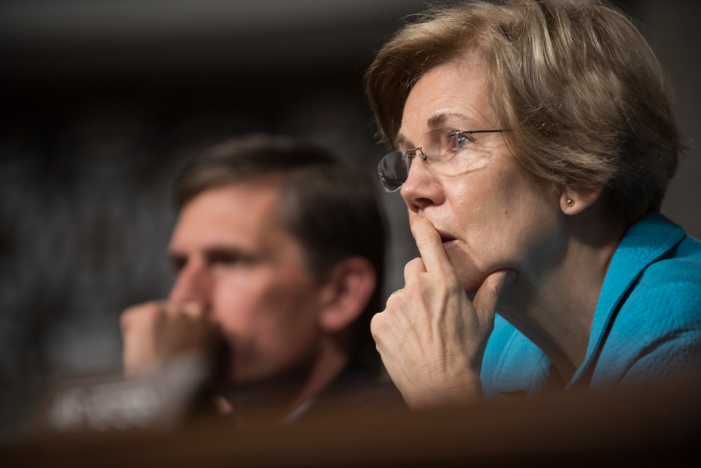 Warren Calls for Probe into Dogecoin's Unexpected Foray into Student Loan Data, Suspects Furry Mascot Shiba Inu as Master
